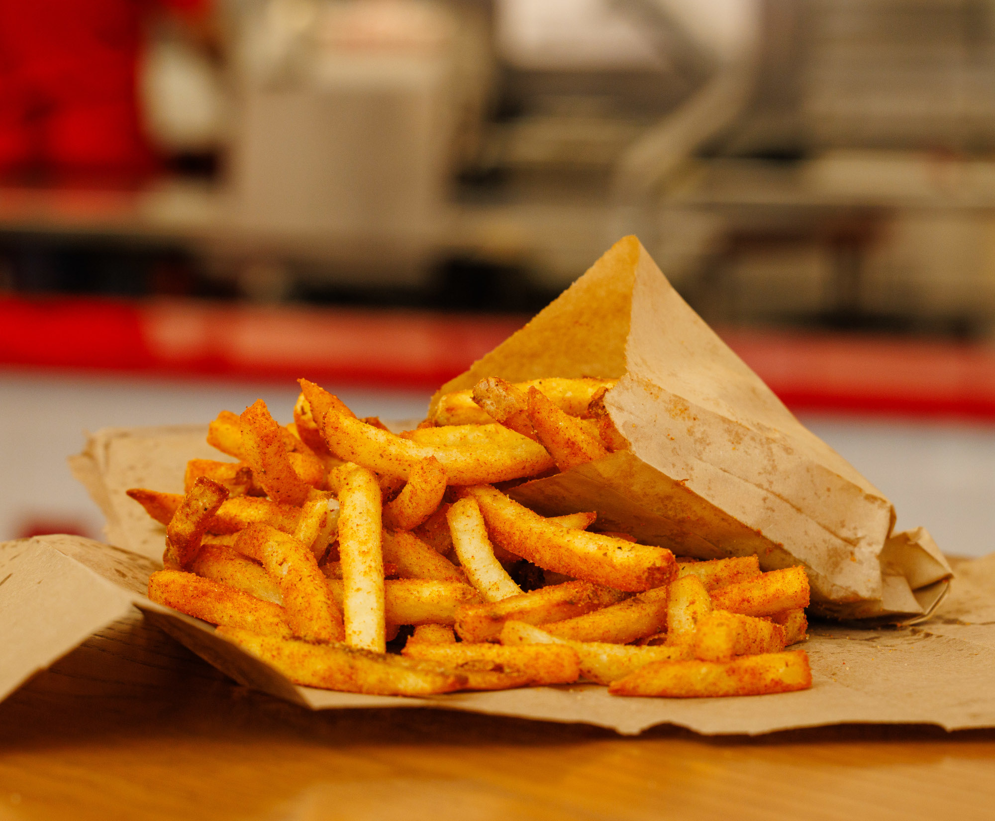 A close-up photograph of a Five Guys medium Cajun fry.